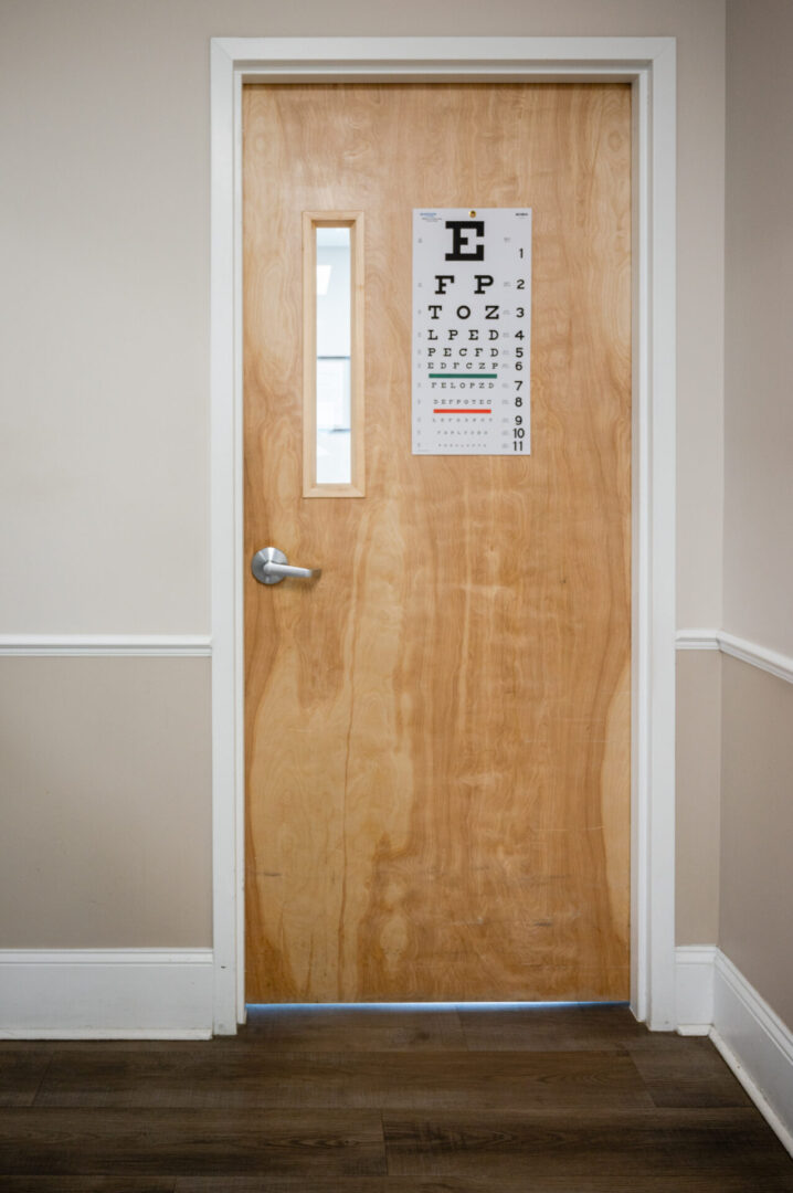 A door with an eye chart on it.